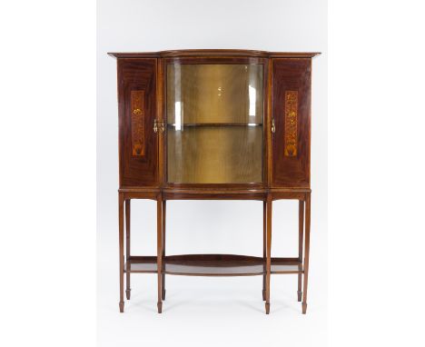 EDWARDIAN INLAID MAHOGANY DISPLAY CABINET WITH BOW FRONTED CENTRE SECTION, the moulded cornice above a conforming central gla