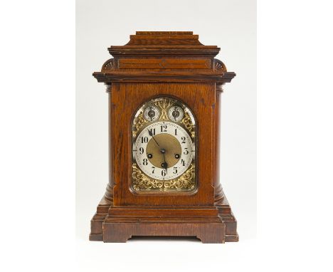 EARLY TWENTIETH CENTURY JUNGHANS OAK CASED MANTLE CLOCK, the 6" brass dial with silvered Arabic chapter ring, matted centre a