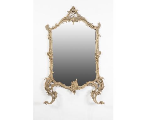 GILT PAINTED CAST IRON FIRE SCREEN, NOW CONVERTED TO A WALL MIRROR, the shaped oblong plat within a Rocaille scroll cast fram