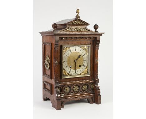 EARLY TWENTIETH CENTURY LENZKIRCH, GERMAN MANTLE/ BRACKET CLOCK WITH CARVED OAK AND GILT BRASS CASE, the 6 ½" brass dial with