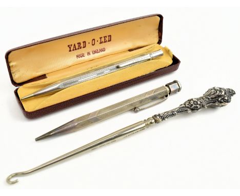 Two 20th century silver Yard O'Led engine turned propelling pencils. The lot to include a hallmarked silver propelling pencil