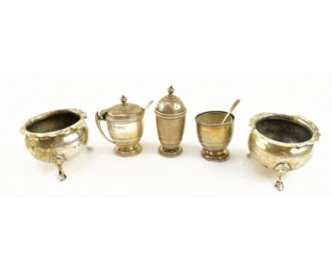 A 20th century hallmarked silver three-piece cruet set. The lot to include a hallmarked silver mustard pot, a pepperette and 
