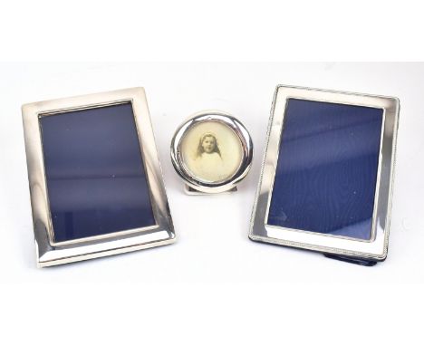 A collection of hallmarked silver photograph frames, all with lined easel backs. To include an example by Robert Carr, Sheffi