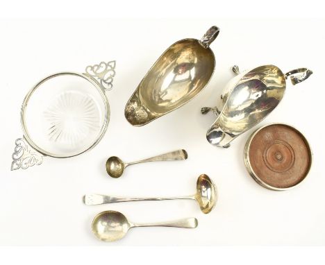 A collection of seven 19/20th century hallmarked silver pieces. The lot to include a pair of Victorian sauce boats. Hallmarke