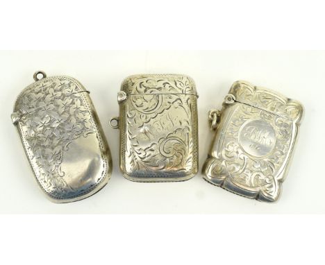 A collection of three Victorian to George V hallmarked silver vestas. The lot to include a Victorian hallmarked silver vesta.