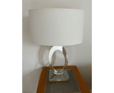 A perplex sculptural lamp with white shade 