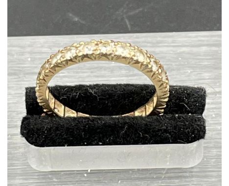 A 9ct gold eternity ring, size N (1.9g)