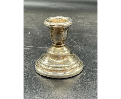 A single silver squat candlestick, hallmarked for Birmingham 1924