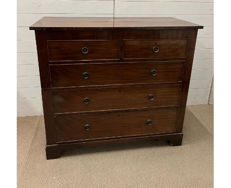 A mahogany two over three chest of drawers on bracket feet, in two parts (H110cm W122cm D54cm)