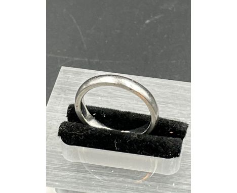 A Platinum 4mm wedding ring, engraved with date. 5g (Size L)