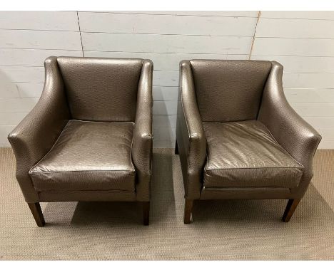 A pair of lounge chairs by R. Griffiths Woodwear Ltd 