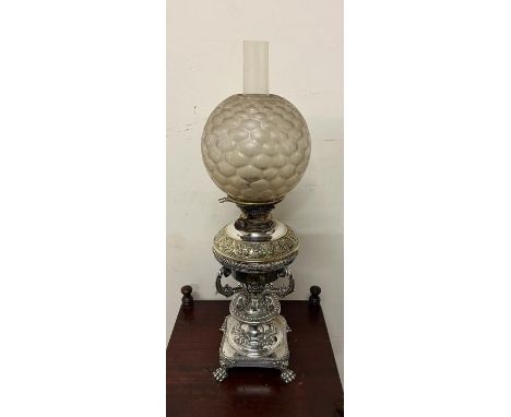 An oil burner messenger lamp with golf ball style glass shade and white metal stand