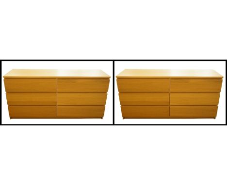PAIR OF LIGHT OAK CHEST OF DRAWERS
each with an arrangement of six drawers and with a glass top, 160cm wide 