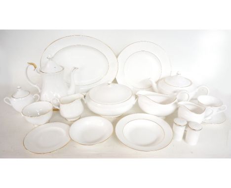 WEDGWOOD SIGNET GOLD DINNER SERVICE
comprising dinner plates, soup bowls, side plates, tureens and covers, oval meat plates, 
