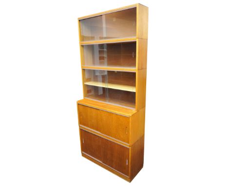 RETRO 'SIMPLEX' LIGHT MAHOGANY SECTIONAL BOOKCASE
the three section top with glazed sliding doors, the lower section with adj