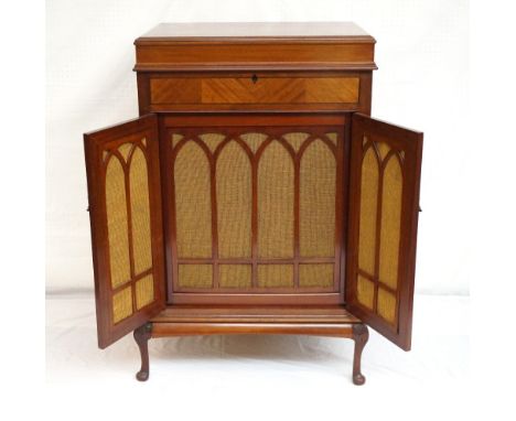 MAHOGANY GRAMOPHONE CABINET
with a moulded lift up lid above a pair of quarter veneerer doors opening to reveal the mesh cove