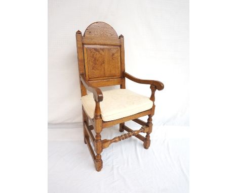 18th CENTURY STYLE OAK AND ELM ARM CHAIR
with an arched panelled back, the arms terminating with scrolls, on turned supports 