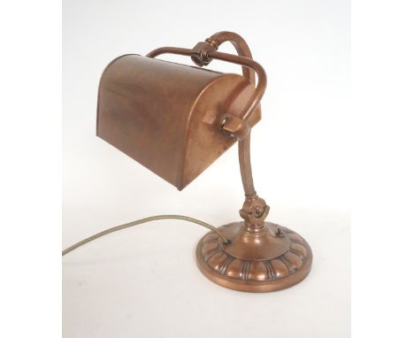 ART NOUVEAU COPPER DESK LAMP
with a stylized shade on a shaped arm with a circular base, 37cm high 