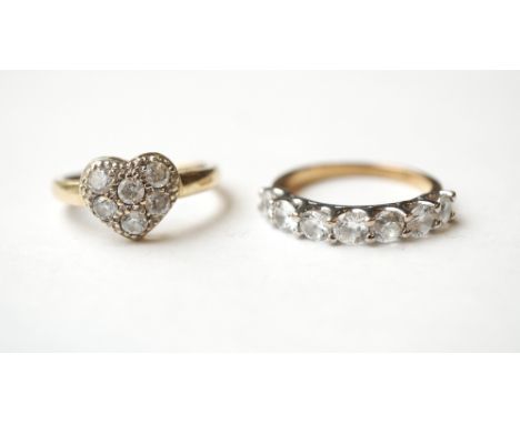 TWO NINE CARAT GOLD CZ SET RINGS
one a seven stone ring and the other with heart shaped setting, ring sizes K-L and K respect