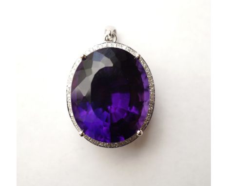 IMPRESSIVE AMETHYST AND DIAMOND CLUSTER PENDANT
the large oval cut amethyst approximately 24cts in multi diamond surround tot