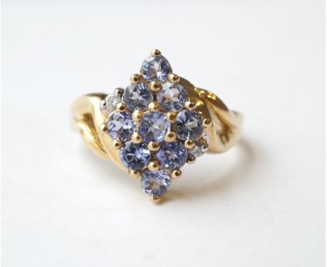 TANZANITE AND DIAMOND CLUSTER DRESS RING
on nine carat gold shank, ring size K-L