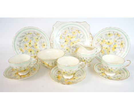 1940's TUSCAN 'PLANT' CHINA TEA SET
with floral decoration, comprising twelve cups; twelve saucers; twelve side plates; two c