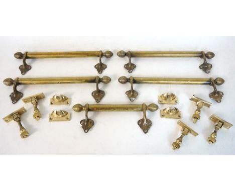 SELECTION OF BRASS WINDOW FURNITURE
comprising five sash window handles with finial decoration and five window locks  