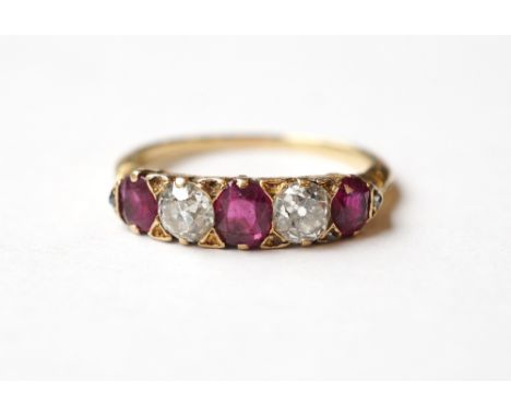 DIAMOND AND RUBY FIVE STONE RING
on unmarked gold shank, the two diamonds totalling approximately 0.6cts, ring size O-P