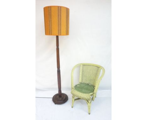 MAHOGANY STANDARD LAMP
with a turned tapering column and circular base with bun feet, 176cm high including shade, together wi
