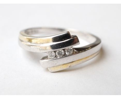 DIAMOND THREE STONE RING
in attractive white and yellow gold twist setting, in nine carat gold, ring size K-L