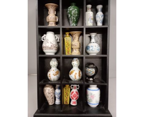 A collection sixteen of Franklin Oriental vases including Japan and Taiwan, with display rack