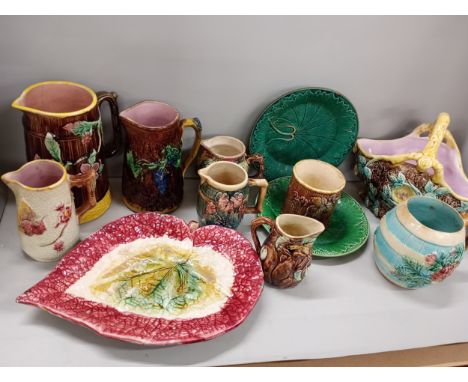 A collection of Majolica pottery comprising of jugs, ceramic basket, plate, and including a Wedgwood leaf plate.  **THIS LOT 
