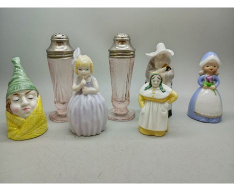 A pair of rose glass peppers with lace design, four Royal Worcester candle snuffers, The Abbess, French Cook, Mr Caudle and H