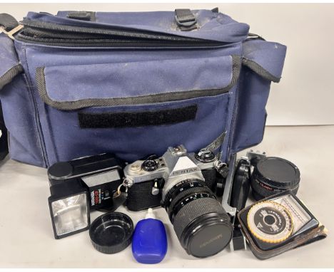 A Pentax ME Super camera with lens, flash, etc.