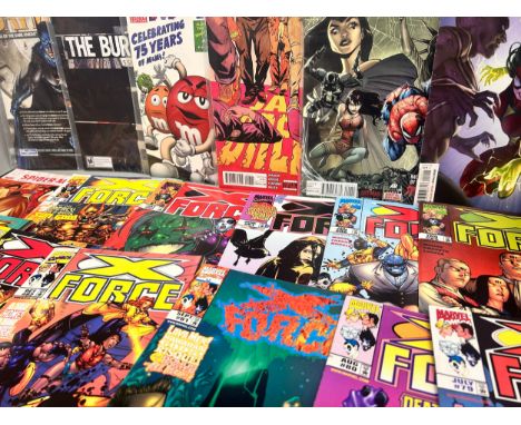 A collection of comics including Marvel, Batman DC, X-Force, Justice League and Stormwatch