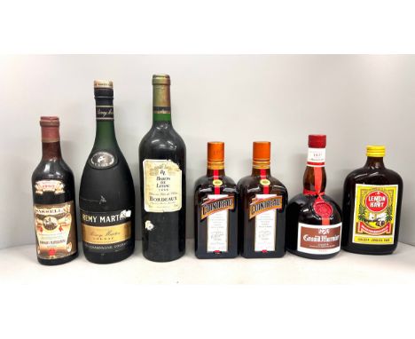 Seven bottles of wines and spirits including Baron de Lestac Bordeaux 1999, Sassella Enologica Valtellinese 1969, Remy Martin