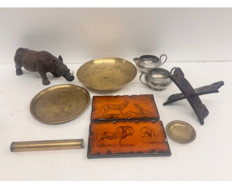 A collection of items including cribbage game, two plaques with big cat scenes handcrafted by Arjeejay, a rhino figure, orien