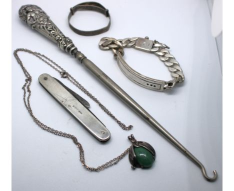 Selection of Sterling Silver items.  To include a Sterling Silver ID Curb Link bracelet (Missing stones), a Sterling Silver A