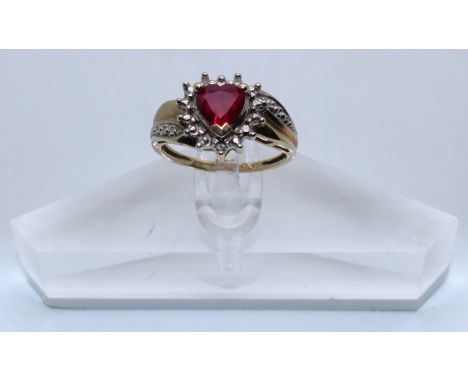 9ct Yellow Gold Pink Heart Shaped Synthetic Ruby & Diamond ring.  The ring is hallmarked '375' for 9ct Gold.  There is three 