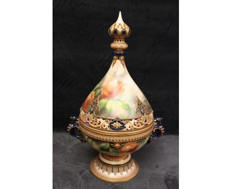 A Hadley's Worcester twin-handled pot pourri and cover painted with roses, the pierced cover and base with moulded borders on