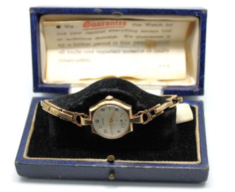 Ladies 9ct Gold Rotary mechanical wristwatch with 9ct Gold hallmarked stretchable bracelet.  The 9ct Gold round watch face me