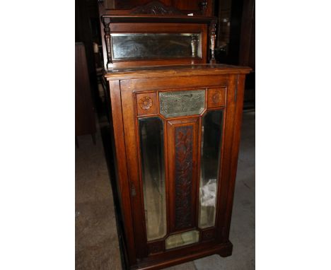 Narrow mahogany shelved cupboard&nbsp; Mirrored shelf with carved plinth over a cupboard with 4 shelves, bevelled mirror and 