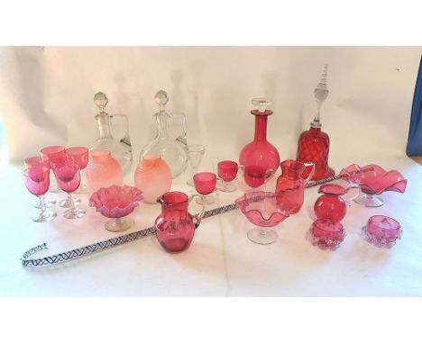 A collection of Victorian and later Ruby glass items and a pair of clear glass decanters, along with a vintage Nailsea walkin