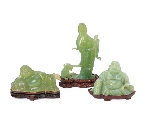 THREE CHINESE JADE / SERPENTINE FIGURAL CARVINGS
Comprising: a female figure holding a baby with a mythical beast at her feet