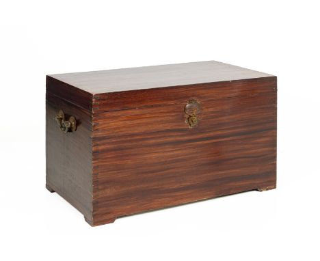 AN ANGLO INDIAN TEAK TRUNK Late 19th/early 20th C., with hinged cover and twin carrying handles, on bracket feet 62cm x 101cm