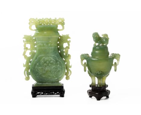 A CHINESE JADE /SERPENTINE VASE AND COVER AND TRIPOD CENSER
The vase and cover with phoenix handles and stylised scroll decor