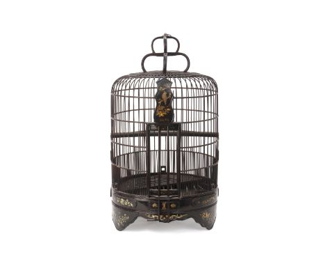 A BLACK LACQUER AND MOTHER OF PEARL INLAID BIRDCAGE
With foliate decoration
65cm high
Condition: Condition Report
A repair to