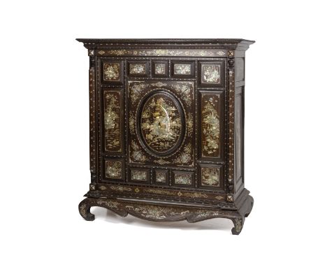 A MOTHER OF PEARL INLAID HARDWOOD CABINET The central panel with a scene of figures in a landscape setting with a temple, gar