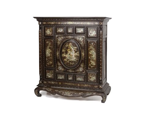 A MOTHER OF PEARL INLAID HARDWOOD CABINET The central panel with a scene of figures in a landscape setting with a temple, gar