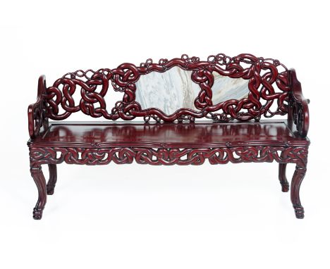 A CHINESE MARBLE INSET CARVED ROSEWOOD SOFA
The sloping back rest inset with two marble panels, within intertwining knotted c